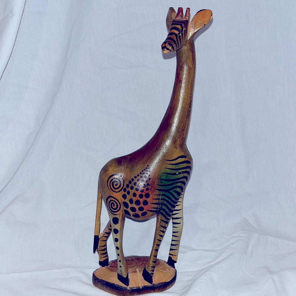 Hand carved giraffe, by craftsmen of Kenya from African muhuhu wood 12” tall